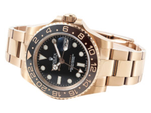GMT-Master II Rose Gold ‘Root Beer’ (40mm) watch with black dial, brown and black bezel, and matching rose gold bracelet.