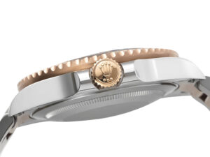 Side view of GMT-Master II Two Tone Rose Gold and Stainless Steel 'Root Beer' (40mm) showcasing crown detail and bezel edge.