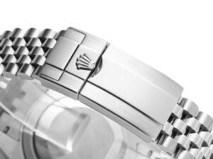 Close-up of the clasp on the stainless steel bracelet of the GMT-Master II 'Bat Girl' (40mm) with crown logo engraved.