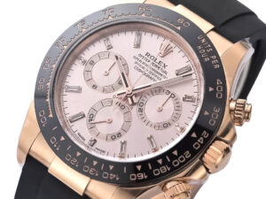 Cosmograph Daytona Rose Gold Oysterflex with Pink Dial, featuring a black bezel and sleek rubber strap design.