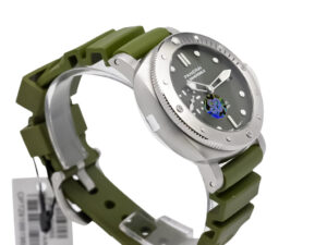 Luminor Submersible 42 watch with brushed stainless steel case, verde militare dial, and green rubber strap.