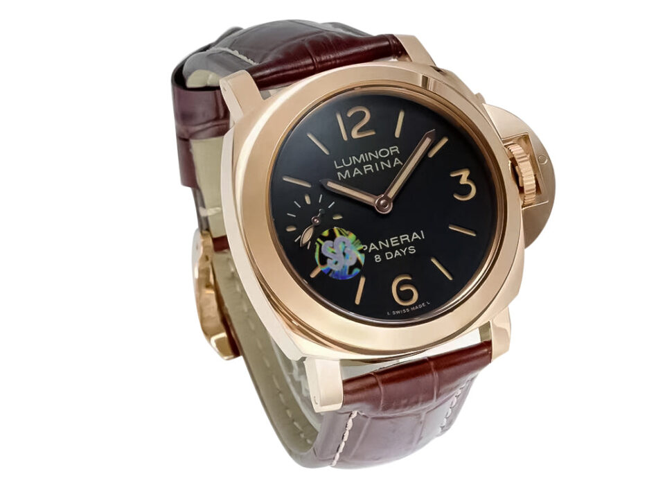Luminor Marina 44 8 Days Automatic watch in red gold with a brown dial and brown leather strap, displayed at an angle.
