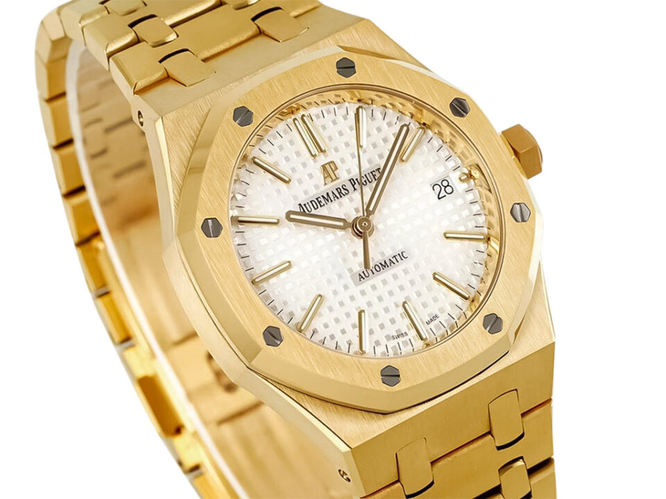 Royal Oak Yellow Gold watch with a 37mm case, silver patterned dial, and gold bracelet displayed at an angle.