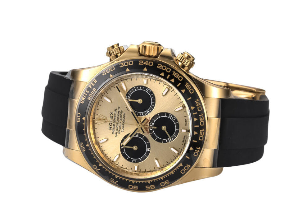 Cosmograph Daytona Yellow Gold Oysterflex with Champagne Dial (2023), showcasing gold case, black bezel, and rubber strap.