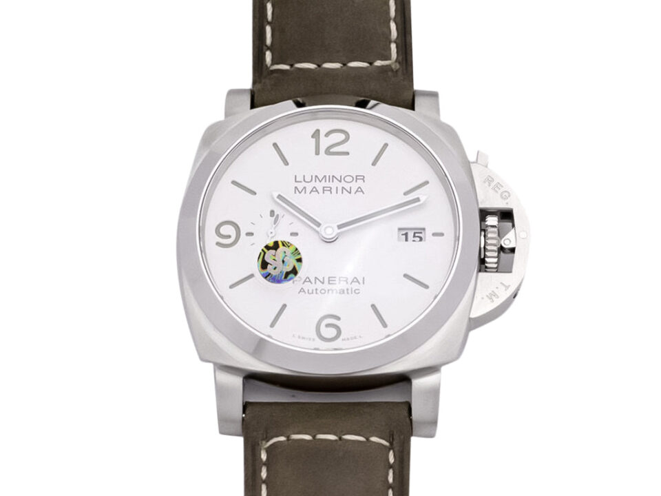Luminor 1950 44mm watch with brushed stainless steel case, polished bezel, white dial, and brown leather strap.