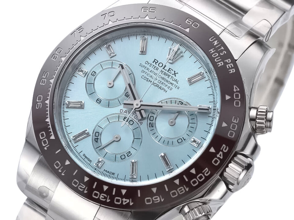 Cosmograph Daytona Platinum watch featuring an ice blue diamond dial, brown ceramic bezel, and stainless steel bracelet.