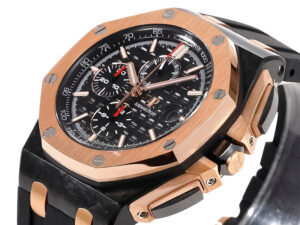 Royal Oak ‘Offshore Chronograph’ 44mm watch in ceramic and pink gold with black textured dial and black strap.