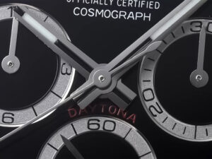 Close-up of the Cosmograph Daytona Stainless Steel (2023) black dial featuring chronograph subdials and sleek hands.