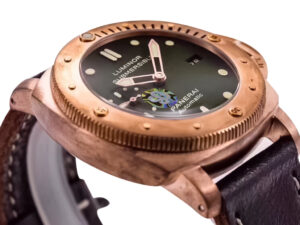 Luminor Submersible 1950 3 Days Automatic Titanium and Bronze, Green Dial, Brown Strap, 47mm watch displayed at an angle.