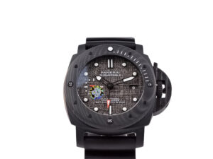 Luminor Submersible 47 Luna Rossa ‘Carbotech’ watch with forged carbon case, grey textured dial, and black rubber strap.