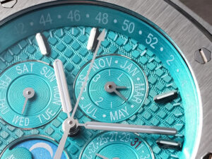 Close-up of Royal Oak 'Perpetual Calendar' Stainless Steel UAE with textured turquoise dial, intricate details and markers.
