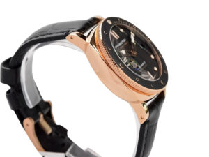 Luminor Submersible 42 'Goldtech' watch with red gold case, black dial, and black strap displayed at a side angle.