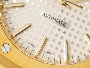 Detailed close-up of the Royal Oak Yellow Gold (37mm) with silver dial, showcasing its elegant guilloché pattern and markers.