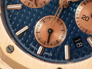 Close-up of the Royal Oak Chronograph Pink Gold with Blue Dial (41mm), showcasing its intricate design "Swiss Made" detail.