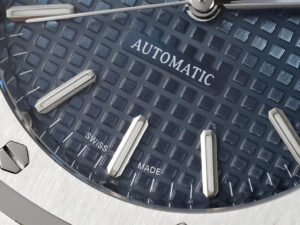 Close-up of the blue dial on the Royal Oak Stainless Steel watch (37mm), featuring "Automatic" text Swiss-made craftsmanship.