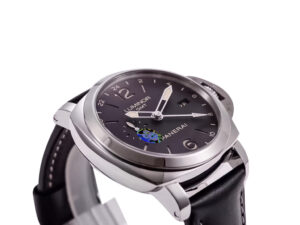 Luminor 1950 3 Days GMT Automatic watch with stainless steel case, black dial, and black strap displayed at an angle.