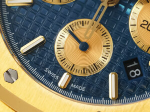 Close-up of the Royal Oak Chronograph Yellow Gold with Blue Dial (41mm) showcasing its textured blue face and gold details.