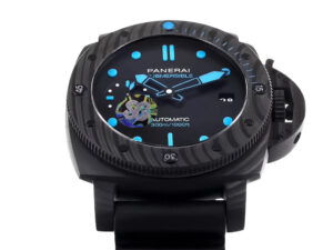 Luminor Submersible 47 watch with forged carbon case and bezel, black dial, blue accents, and a black rubber strap.