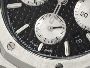 Close-up of the Royal Oak Chronograph Stainless Steel watch with a black dial, showcasing sub-dials, date display.