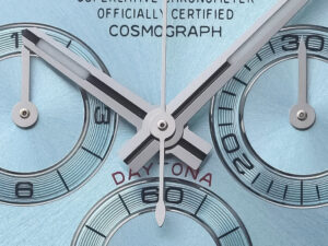 Close-up of the Cosmograph Daytona Platinum watch with ice blue diamond dial, showcasing its intricate chronograph details.