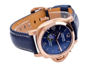 Luminor 1950 44 3 Days Automatic Goldtech Cushion Case watch with 'Sole Blu' sunburst dial and blue leather strap.