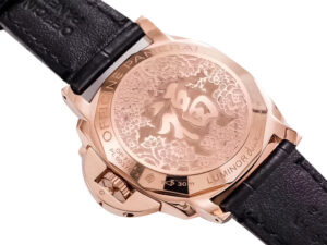 Back view of the Luminor Due 38 Automatic ‘Oro Rosso’ Red Gold Case with engraved design, black strap displayed.