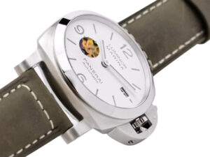 Luminor 1950 44mm watch with brushed stainless steel case, polished bezel, white dial, and brown leather strap.