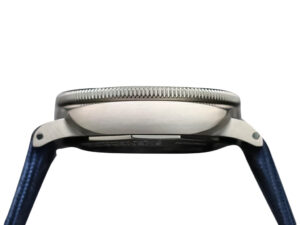 Side view of Luminor Submersible 47 'Mike Horn Edition' watch with a titanium case, titanium bezel grad, and blue straps.