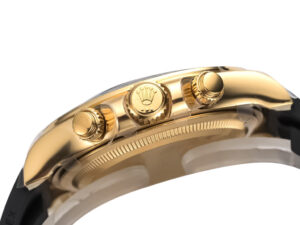 Side view of the 2023 Cosmograph Daytona Yellow Gold Oysterflex with Champagne Dial, showcasing its gold pushers and bezel.
