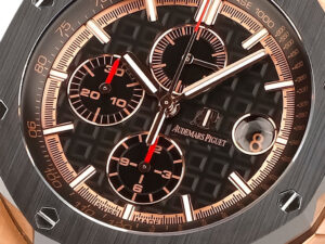Royal Oak Offshore Chronograph in pink gold, 44mm, black dial with subdials and luminescent hands; luxury watch design.