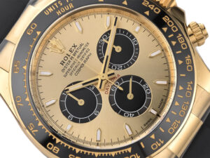 Close-up of Cosmograph Daytona Yellow Gold Oysterflex with Champagne Dial (2023), featuring black sub-dials and tachymeter bezel.
