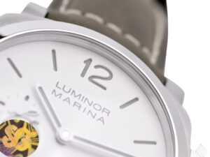 Close-up of Luminor 1950 44 3 Days Automatic with brushed stainless steel case, polished bezel, white dial, & gray strap.