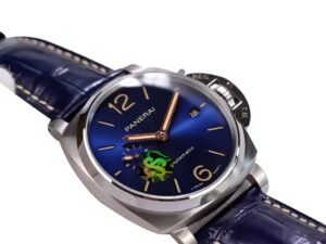 Luminor Due 42 Automatic watch with a titanium case, blue dial featuring gold details, and matching blue leather strap.