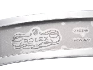Close-up of the engraved inner clasp of a Cosmograph Daytona Platinum watch, featuring "Rolex" logo and "Geneva Swiss Made."