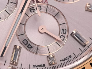 An up-close look at the Cosmograph Daytona Rose Gold watch with Diamond Pink Dial, displaying fine details and craftsmanship.