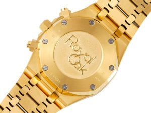 Back view of Royal Oak Chronograph Yellow Gold 41mm, showcasing engraved "Royal Oak" text and secured screws on the caseback.