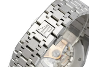 Royal Oak Stainless Steel watch bracelet close-up, showcasing the "AP" logo engraving and glimpse of the automatic movement.