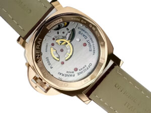 Back view of Luminor Marina 44 8 Days Automatic Red Gold watch showcasing its movement, engraved details, and leather strap.