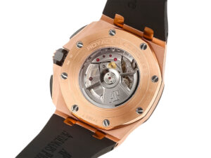 Back view of the Royal Oak Offshore Chronograph in pink gold, showcasing its visible movement and black rubber strap.