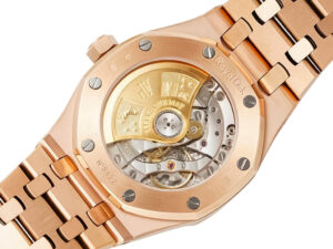 Back view of the Royal Oak Pink Gold with Silver Dial (37mm), showcasing its intricate mechanical movement and gold rotor.