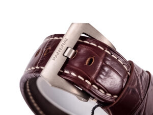 Close-up of the Luminor 1950 Marina 3 Days Automatic Titanium's brown leather strap with Panerai-branded buckle.