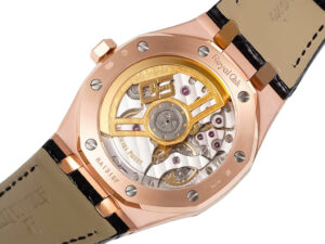 Back view of the Royal Oak Pink Gold '50th Anniversary' watch, showcasing its mechanical movement and pink gold casing.