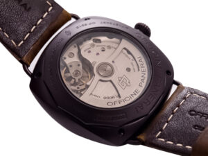 Rear view of the Radiomir Composite Black Seal 3 Days Automatic showing its exposed automatic movement & brown leather strap.