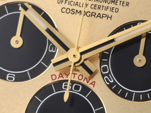 Close-up view of the Cosmograph Daytona Yellow Gold Oysterflex with Champagne Dial, showcasing its elegant design and details.