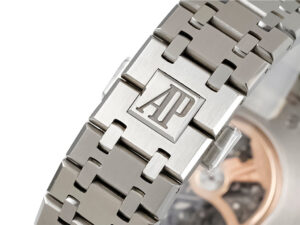 Close-up of the Royal Oak Stainless Steel Openworked Double Balance Wheel (41mm) bracelet with AP logo engraving.