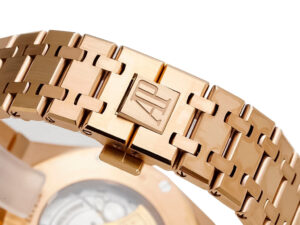 Close-up view of the Royal Oak Pink Gold bracelet with AP logo clasp, showcasing intricate craftsmanship and design.