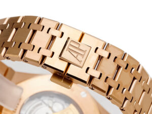 Close-up view of the Royal Oak Pink Gold 41mm watch bracelet, showcasing the AP clasp detail and polished finish.