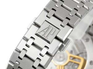 Close-up of the Royal Oak Stainless Steel bracelet showcasing AP logo engraving, with a glimpse of the detailed movement.