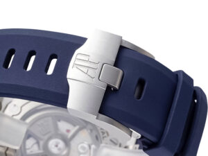 Close-up of Royal Oak Offshore Diver watch's stainless steel clasp with blue rubber strap and visible caseback detailing.