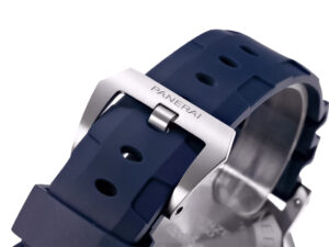 Close-up of the Luminor Submersible 42 with a stainless steel buckle and blue rubber strap, showcasing sturdy design details.